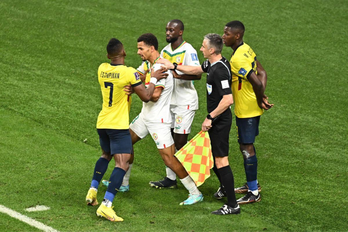 Iliman Ndiaye of Senegal clashes with Pervis Estupinan of Ecuador