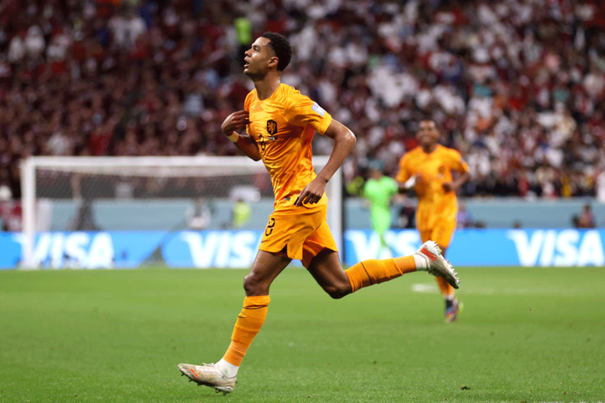 The Netherlands' Cody Gakpo celebrates after scoring their team’s first goal