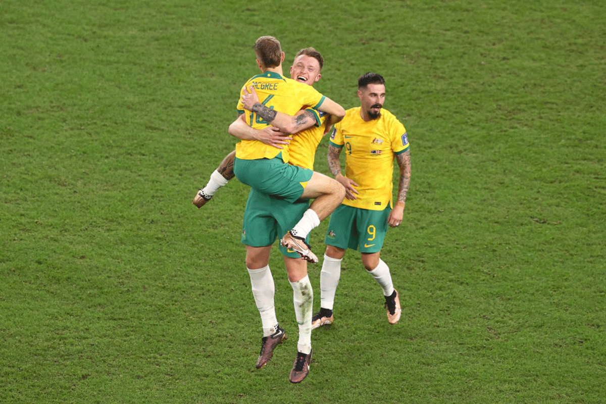 Australia's Joel King, Harry Souttar and Jamie MacLaren celebrate their 1-0 victory over Denmark
