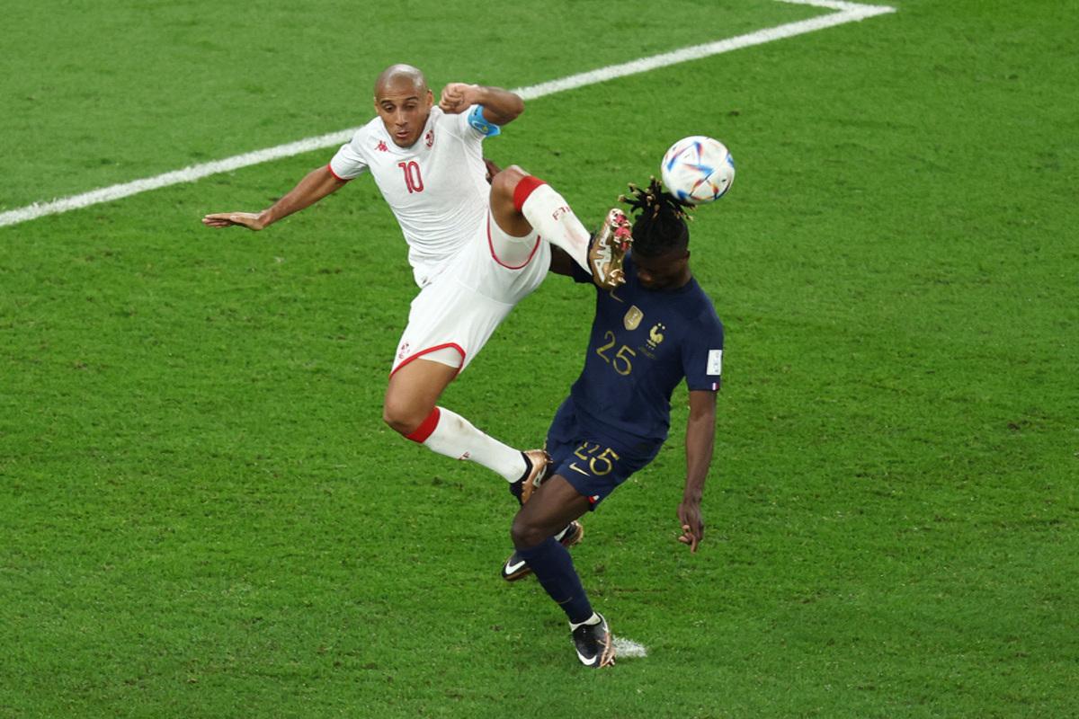 Tunisia's Wahbi Khazri in action with France's Eduardo Camavinga