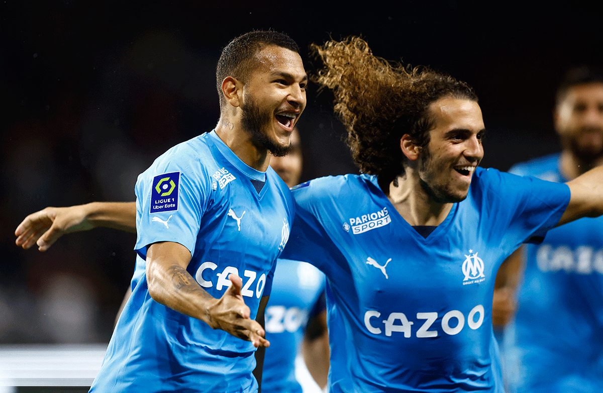 Olympique de Marseille's Luis Suarez celebrates scoring their second goal with Matteo Guendouzi during their Ligue 1 match at Stade Raymond Kopa, Angers, France 