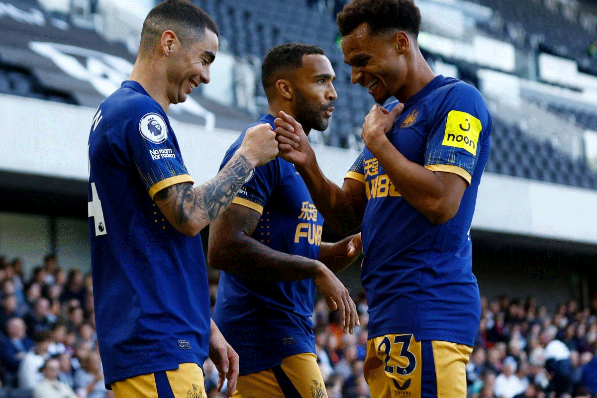 Newcastle United's Miguel Almiron celebrates scoring their fourth goal with Jacob Murphy and Callum Wilson