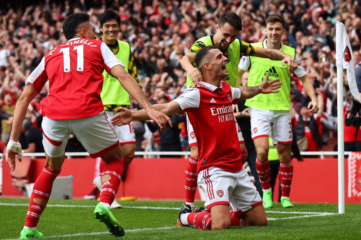 Arsenal's Granit Xhaka celebrates scoring their third goal with Fabio Vieira and Gabriel Martinelli 