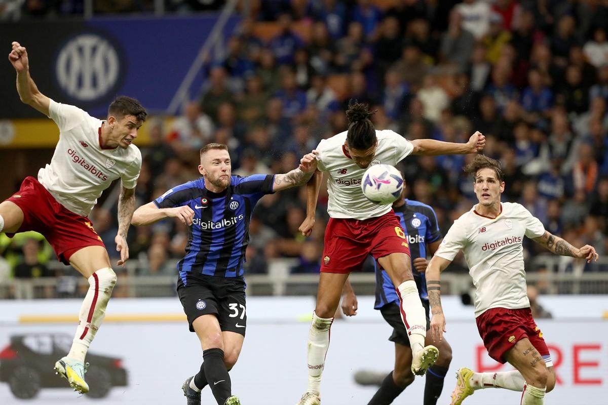 Chris Smalling heads the ball and scores A S Roma's second goal during the Serie A match against Inter Milan at Stadio Giuseppe Meazza in Milan.