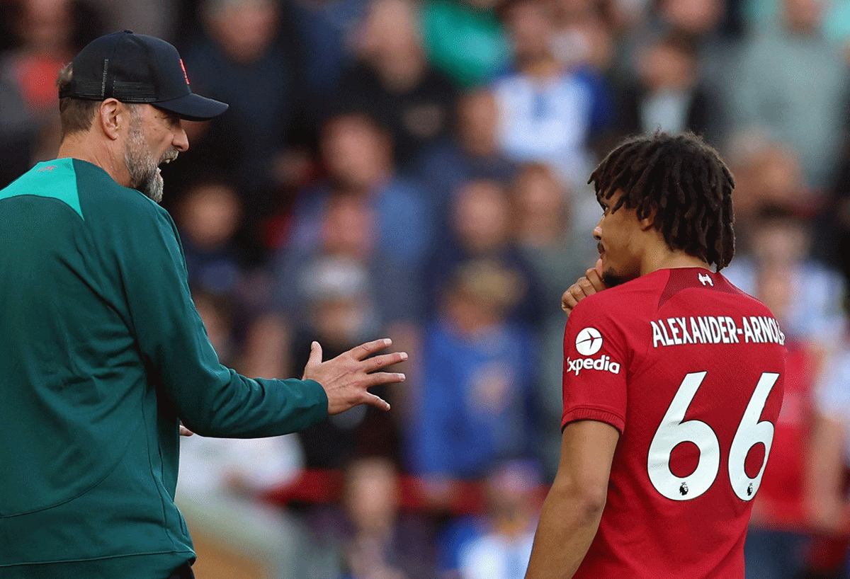 Liverpool manager Juergen Klopp talks to Trent Alexander-Arnold. Klopp said Liverpool would have to come out of the current crisis in a similar way to when they lost several defenders to injuries two seasons ago. 