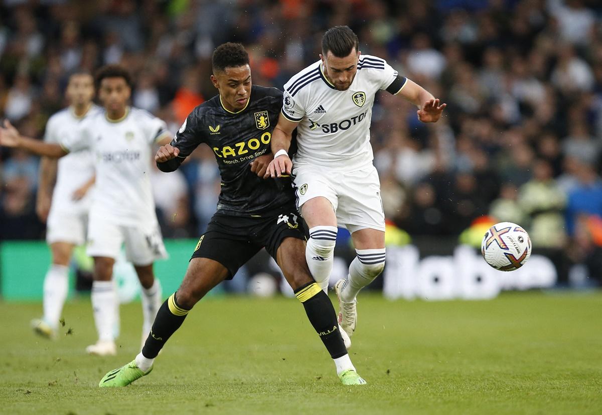 Aston Villa's Jacob Ramsey battles for possession with Leeds United's Jack Harrison.