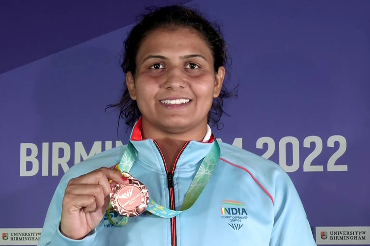 Wrestler Pooja Sihag poses for a photo with a Bronze medal that she won in the Women's Freestyle 76kg category final at the Commonwealth Games (CWG) 2022, in Birmingham