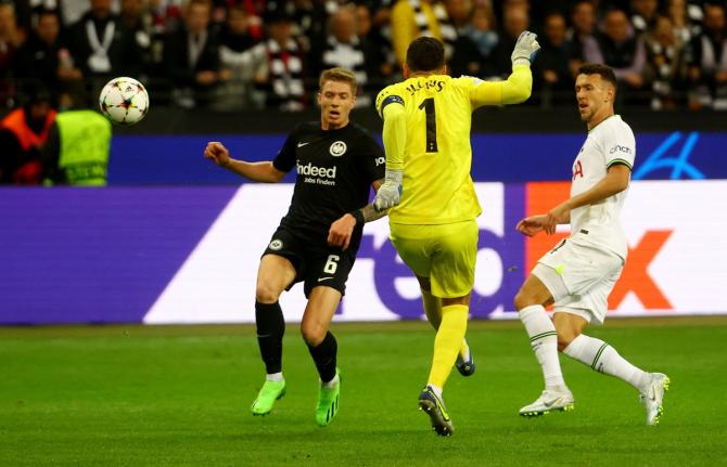 Tottenham Hotspur goalkeeper Hugo Lloris thwarts Eintracht Frankfurt's Kristijan Jakic's as Ivan Perisic watches in the Champions Group D match at Deutsche Bank Park, Frankfurt.