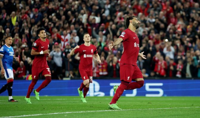 Mohamed Salah celebrates scoring Liverpool's second goal from the penalty spot.
