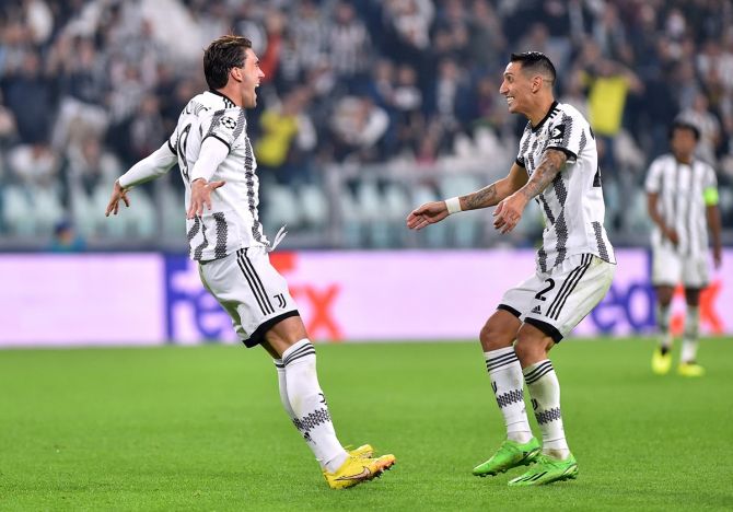 Dusan Vlahovic celebrates scoring Juventus's second goal with Angel Di Maria during the Champions League Group H match against Maccabi Haifa at Allianz Stadium, Turin, Italy.