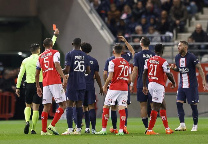 Paris St Germain's Sergio Ramos is shown a red card by referee Pierre Gaillouste.