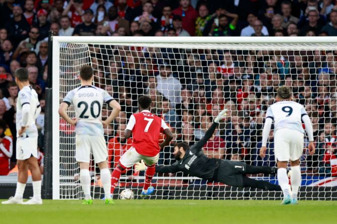 Arsenal's Bukayo Saka scores their third goal from the penalty spot
