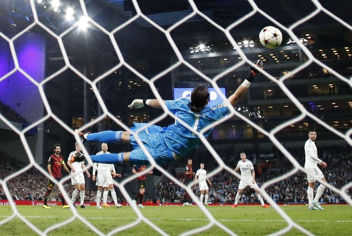 FC Copenhagen goalkeeper Kamil Grabara saves the penalty from Riyad Mahrez.