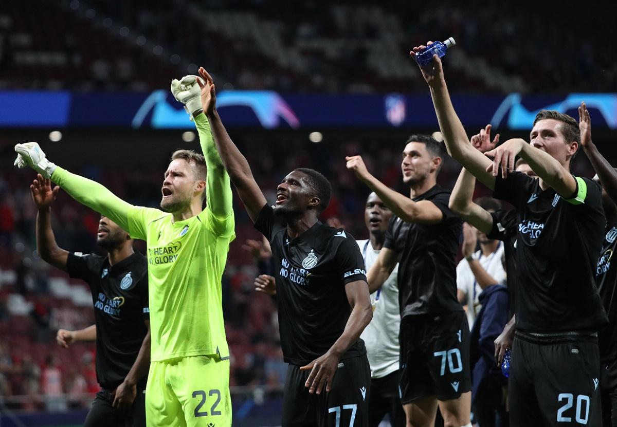 Club Brugge's Simon Mignolet, Clinton Mata and teammates celebrate with fans after victory over Atletico Madrid in the Champions League Group B match at Metropolitano, Madrid, Spain.