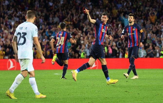 Robert Lewandowski celebrates scoring Barcelona's second goal in the Champions League Group C match against Inter Milan at Camp Nou, Barcelona, Spain.