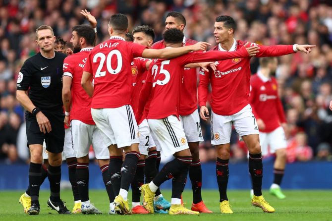 Manchester United's Cristiano Ronaldo and teammates reacts after a goal he scored is disallowed