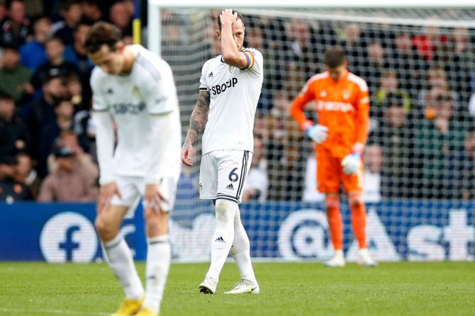 Leeds United's Liam Cooper and teammates look dejected after conceding their second goal