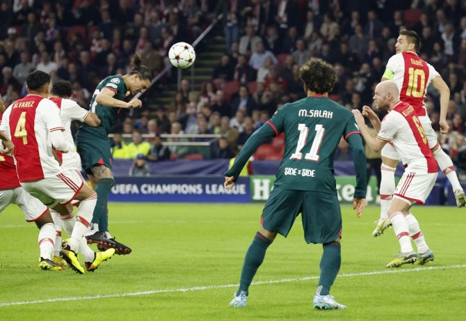 Darwin Nunez glances a header from a corner to score Liverpool's third goal during the Champions League Group A match against Ajax Amsterdam, at Johan Cruijff Arena, Amsterdam.