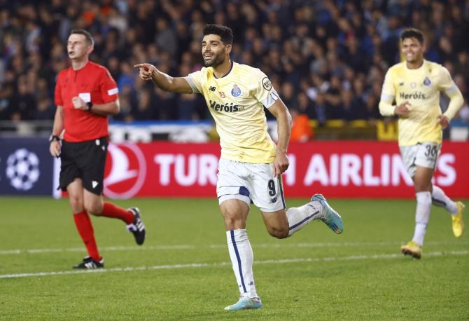 Mehdi Taremi celebrates scoring FC Porto's fourth goal during the Champions League Group B match against Club Brugge, at Jan Breydel Stadium, Bruges, Belgium.