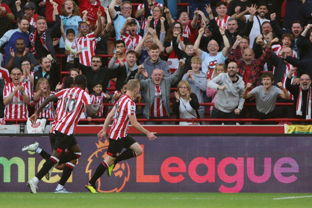 Brentford's Ben Mee celebrates scoring their first goal with teammates