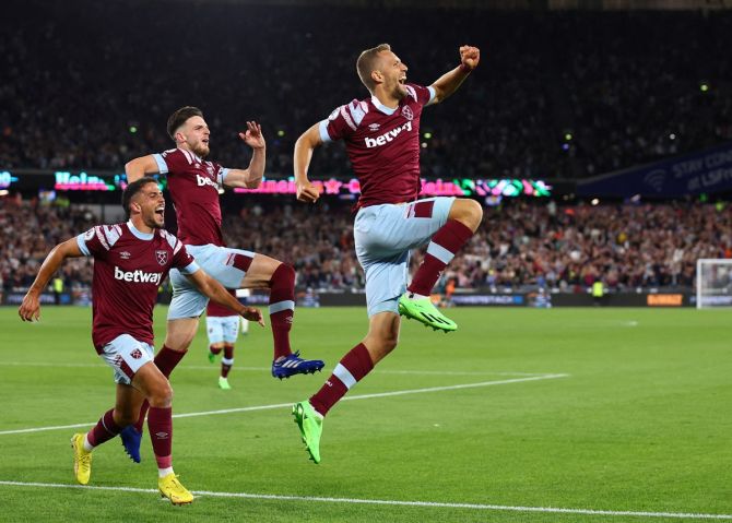 Tomas Soucek celebrates with Declan Rice and Pablo Fornals after scoring the equaliser for West Ham United against Tottenham Hotspur, at London Stadium.
