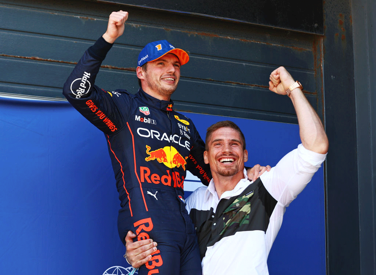 Pole position qualifier Oracle Red Bull Racing's Max Verstappen celebrates with Dutch kickboxer Rico Verhoeven in parc ferme during qualifying of the F1 Grand Prix of The Netherlands at Circuit Zandvoort in Zandvoort, Netherlands, on Saturday