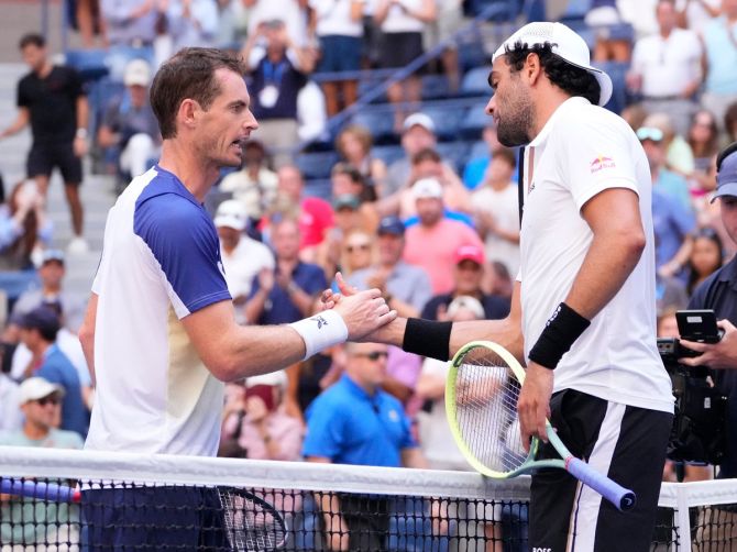 Italy's Matteo Berrettini and Great Britain's Andy Murray shake hands at the net after their third round match at the US Open on Friday.