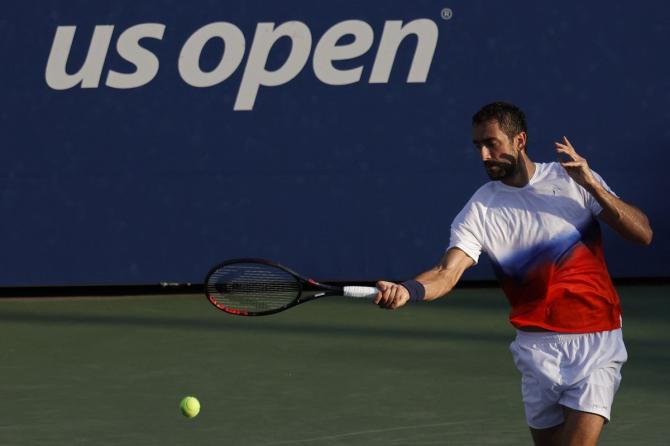 Croatia's Marin Cilic hits a forehand against Great Britain's Daniel Evans.