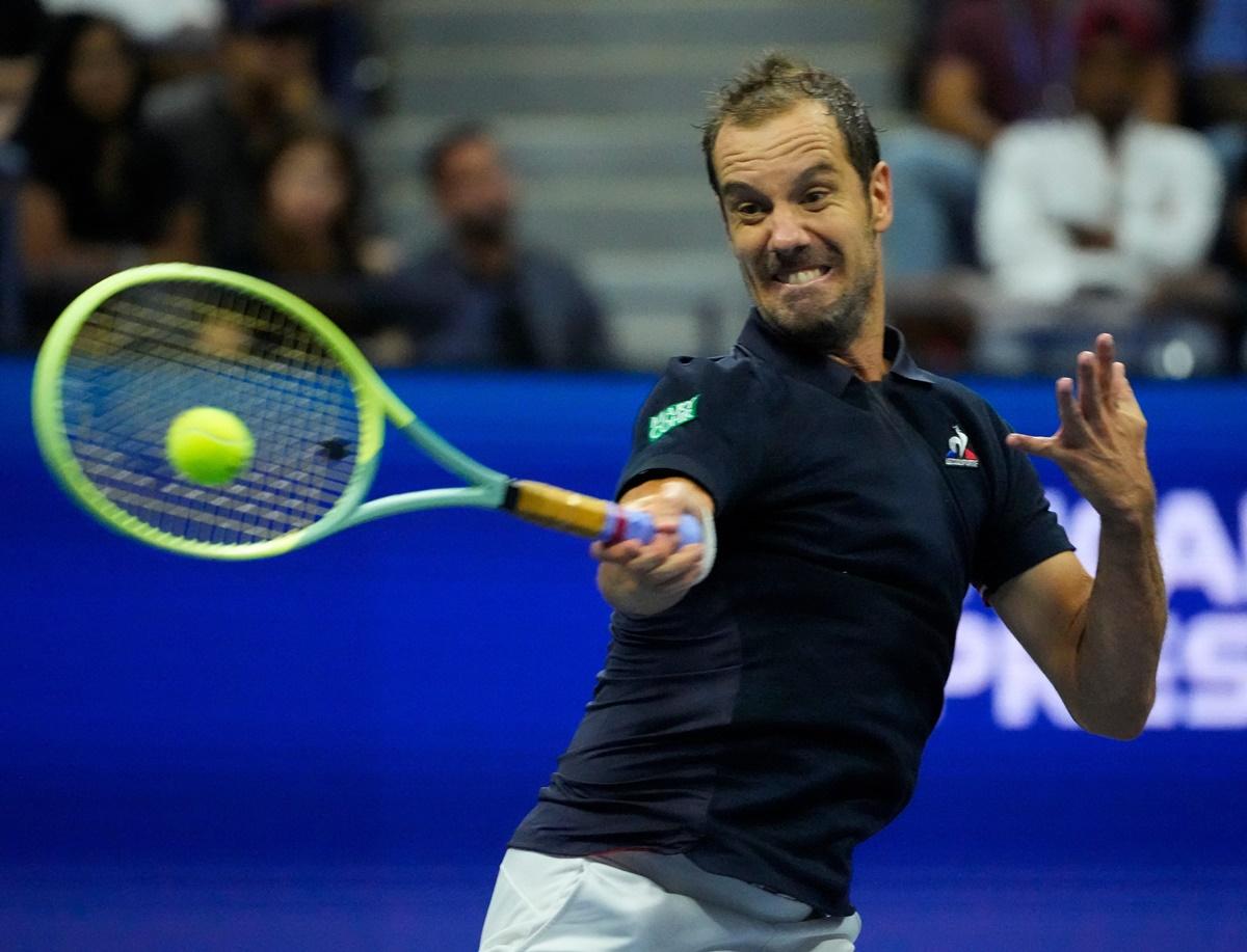 Richard Gasquet makes a forehand return to Rafael Nadal.