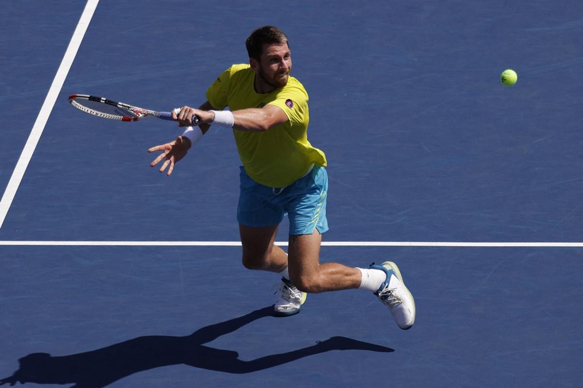 Great Britain's Cameron Norrie hits a volley against Denmark's Holger Rune.