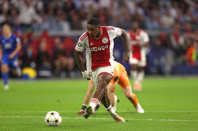 Steven Bergwijn scores Ajax's fourth goal during the Group A match against Rangers FC, at Johan Cruyff Arena in Amsterdam.