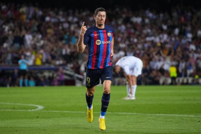 Robert Lewandowski celebrates scoring Barcelona's second goal, his first in the match.