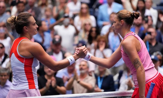 Aryna Sabalenkaa, left, and Karolina Pliskova meet at the net after their quarter-final.