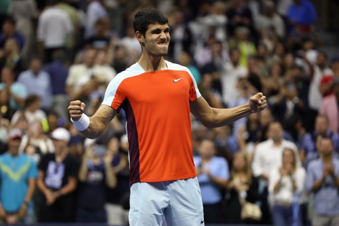 Spain's Carlos Alcaraz celebrates after clinching victory over Frances Tiafoe of the United States in the US Open men's singles semi-final at Billie Jean King National Tennis Center, New York City, on Friday.