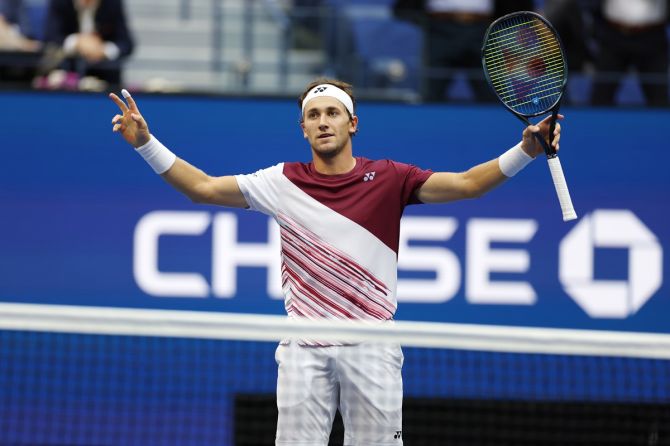 Norway's Casper Ruud raises his arms in triumph after defeating Russia's Karen Khachanov in the US Open men’s singles semi-final at Billie Jean King National Tennis Center, New York City, on Friday.