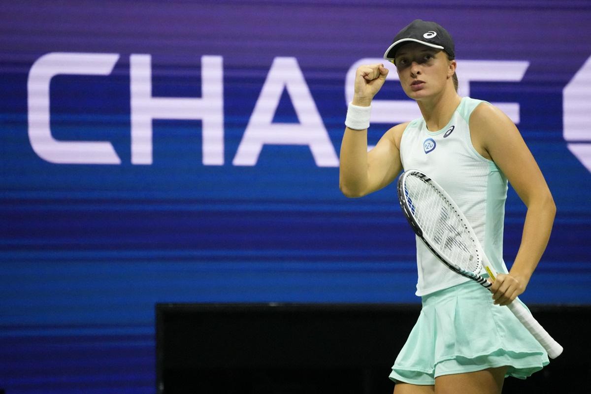 Poland's Iga Swiatek reacts after winning a point against Aryna Sabalenka in the US Open quarter-finals.