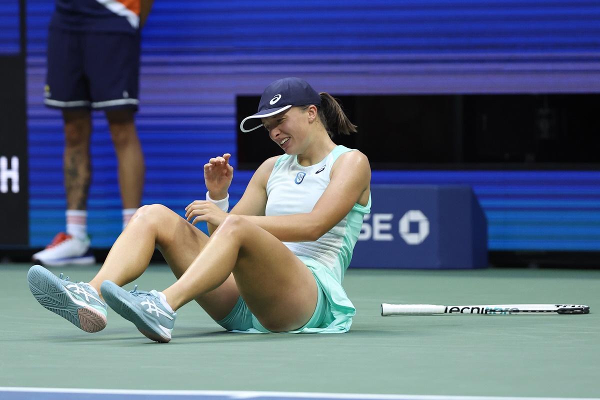 Poland's Iga Swiatek celebrates defeating Tunisia's Ons Jabeur in the US Open women’s singles final at Billie Jean King National Tennis Center in New York City on Saturday.