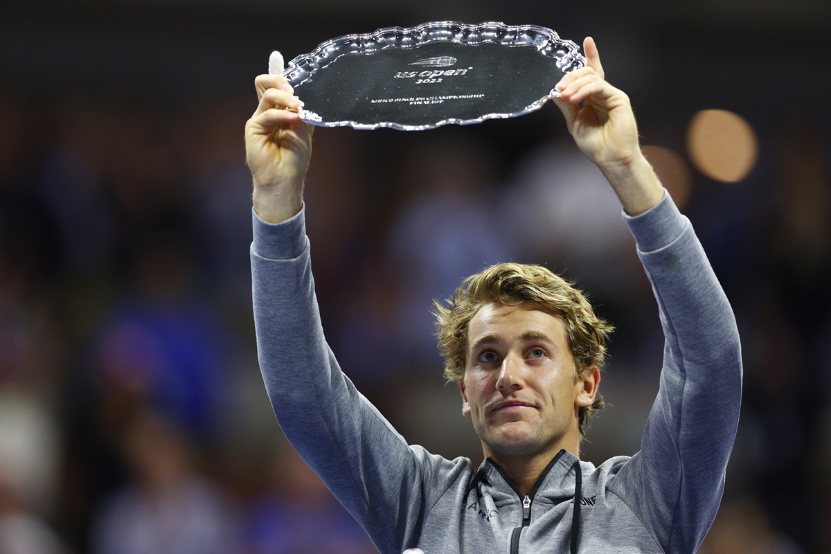 Casper Ruud celebrates with the US Open runner-up trophy.