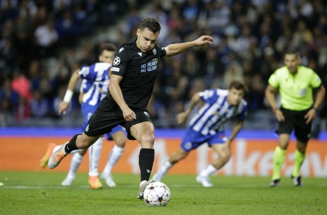 Ferran Jutgla scores Club Brugge's first goal from the penalty spot in the Group B match against FC Porto, at Estadio do Dragao, Porto, Portugal.