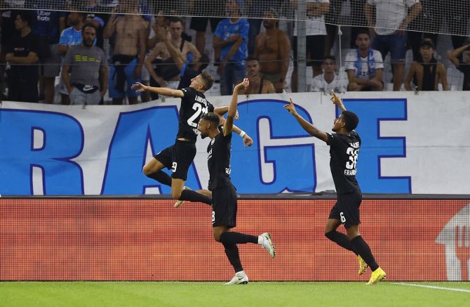 Jesper Lindstrom launches into a celebratory run with teammates after putting Eintracht Frankfurt ahead in the Group D match against Olympique Marseille, at Orange Velodrome, Marseille, France.