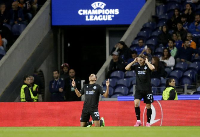 Teenage substitute Antonio Nusa celebrates scoring Club Brugge's fourth goal with Casper Nielsen.