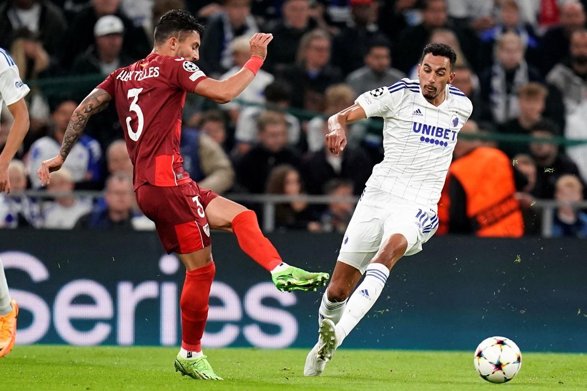 FC Copenhagen's Jose Zeca and Sevilla's Alex Telles battle for possession during the Group G match at Parken, Copenhagen, Denmark.