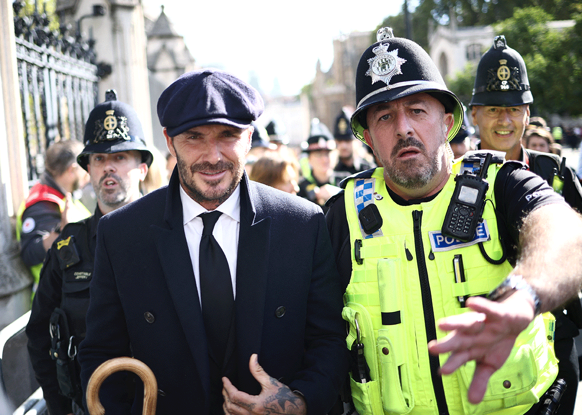 Former football player David Beckham leaves after paying his respects to Britain's Queen Elizabeth lying in state in London, Britain on Friday.
