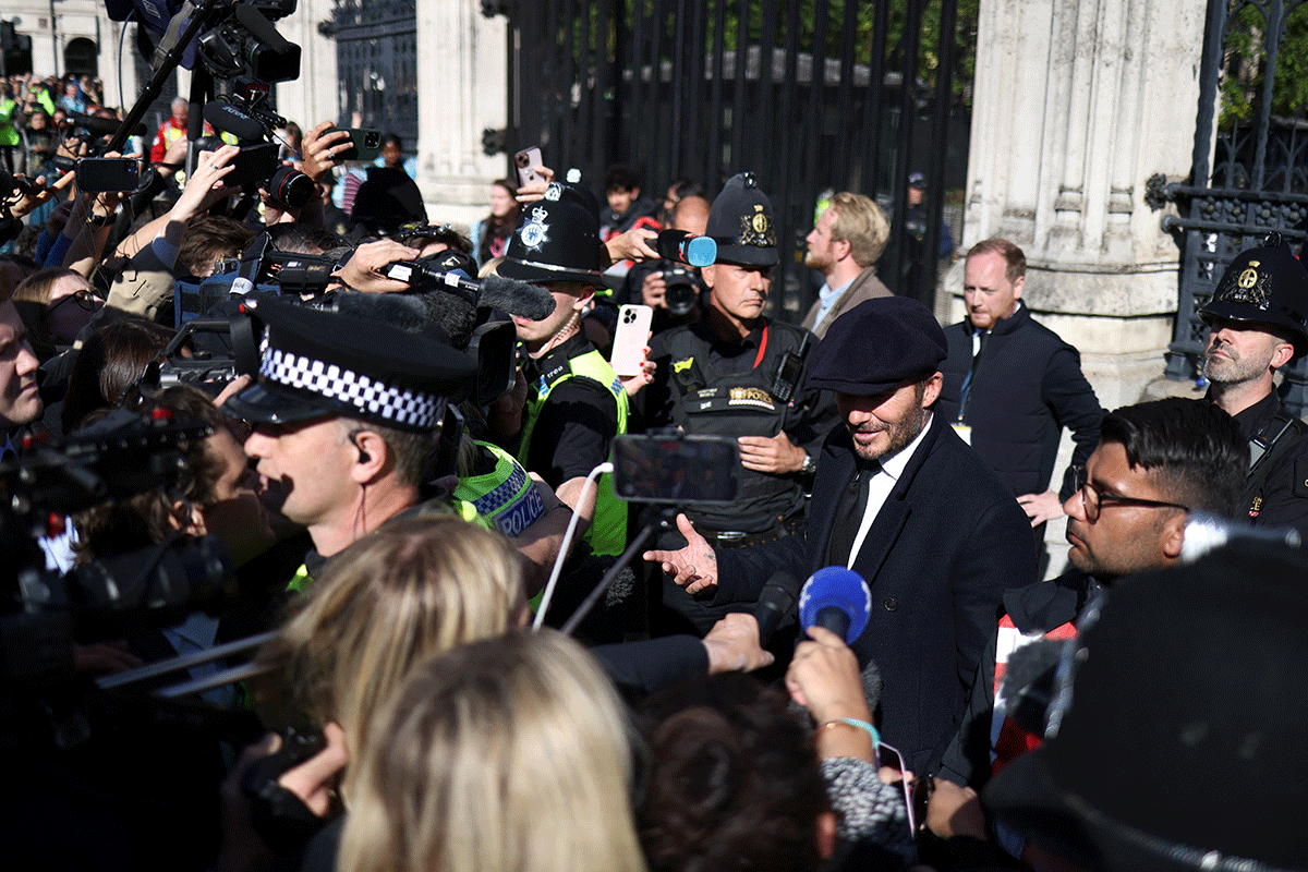 Former football player David Beckham speaks to the media after paying his respects to Britain's Queen Elizabeth lying in state on Friday