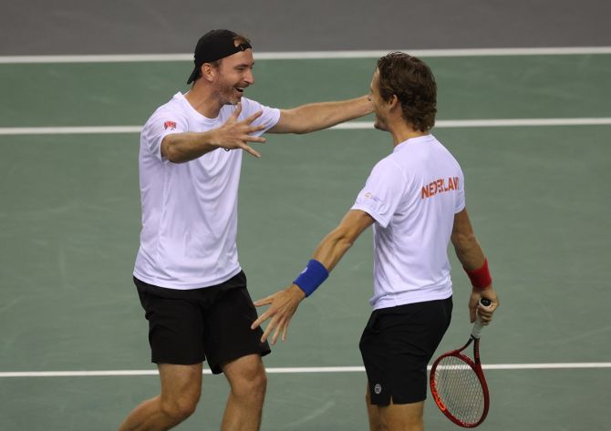 The Netherlands' Wesley Koolhof and Matwe Middelkoop celebrate after defeating Britain's Andy Murray and Joe Salisbury  in the Davis Cup Group D match at Emirates Arena, Glasgow, Scotland, on Saturday. Lee Smith/Reuters