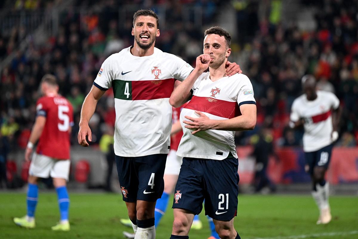 Diogo Jota celebrates scoring Portugal's fourth goal with teammate Ruben Dias.