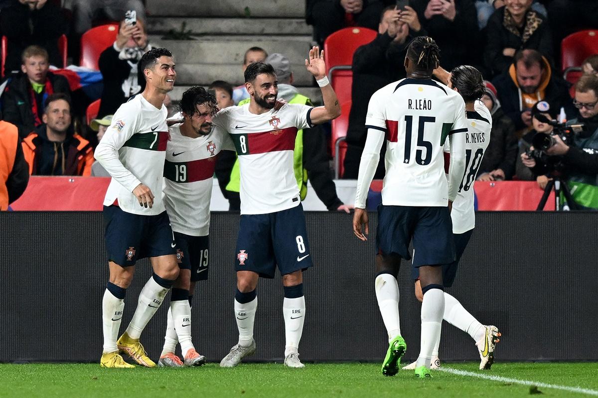 Bruno Fernandes celebrates scoring Portugal's second goal with teammates Cristiano Ronaldo and Mario Rui during the UEFA Nations League A Group 2 match against the Czech Republic, at Fortuna Arena in Prague, on Saturday.