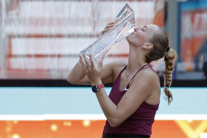 Petra Kvitova celebrates with the Butch Buchholz championship trophy after defeating Elena Rybakina in the women's singles final of the Miami Open, at Hard Rock Stadium, on Saturday.