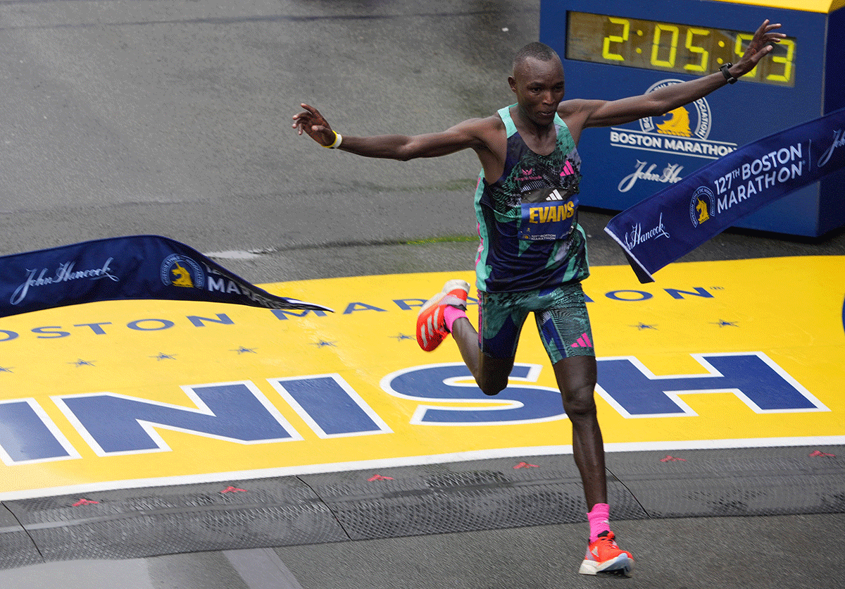 Kenya's Evans Chebet crosses the finish line to win the elite men's race at the 127th Boston Marathon in Boston, Massachusetts on Monday, April 17