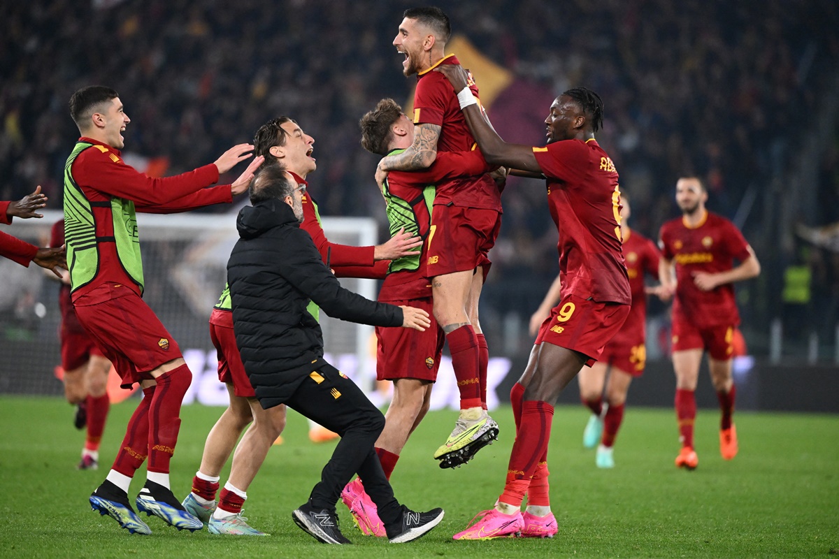 Sevilla's Loic Bade, top, heads the ball past Roma's Tammy Abraham